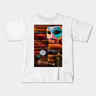 Old Mask On Stack Of Antique Books Kids T-Shirt